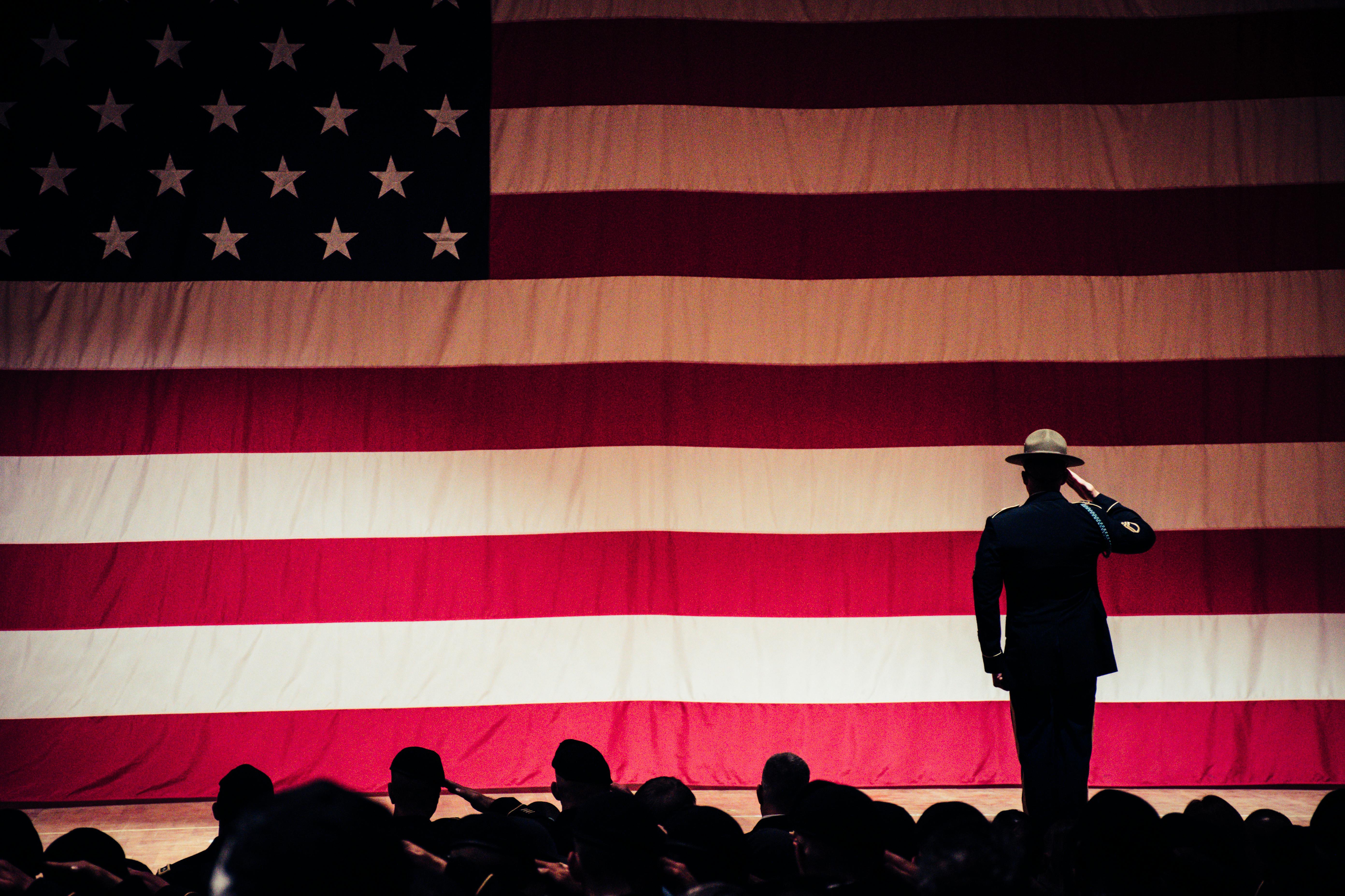 Selective Service Registration Immigration soliders saluting to the U.S. flag